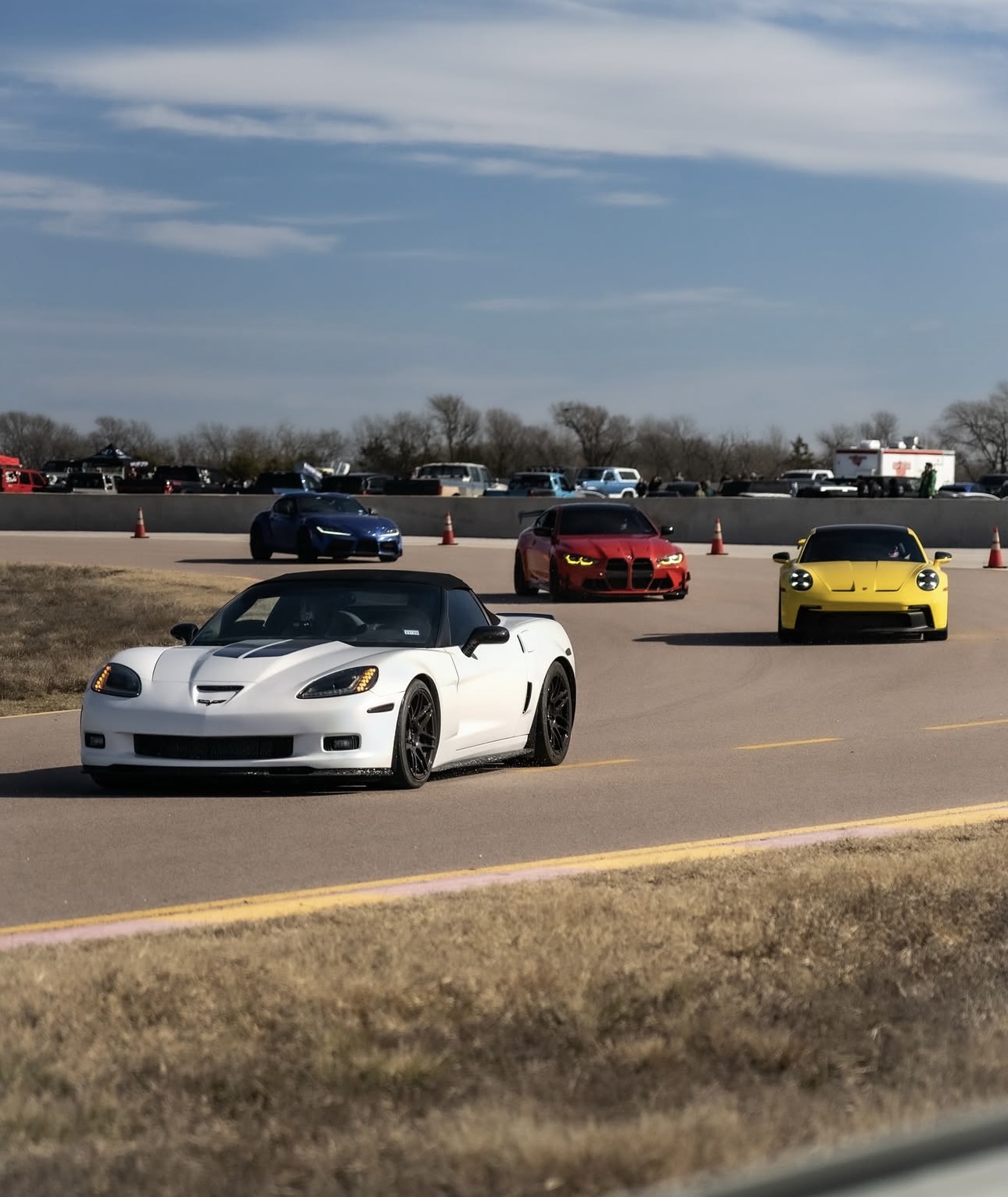 Bobby's 1,150-hp Corvette leading the pack out of the corner in first place on the racetrack